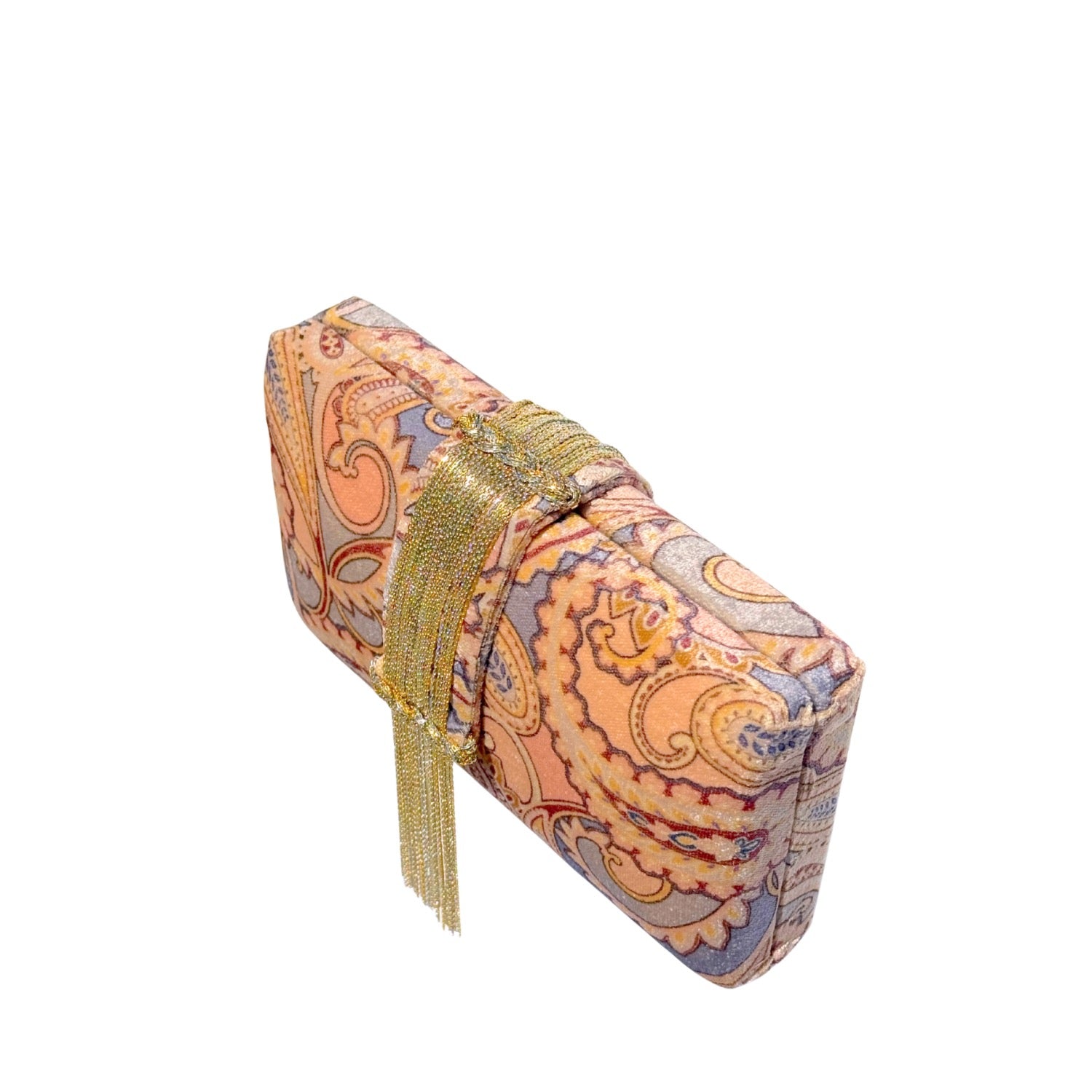 Printed clutch bag with paisley pattern and gold tassel on a white background