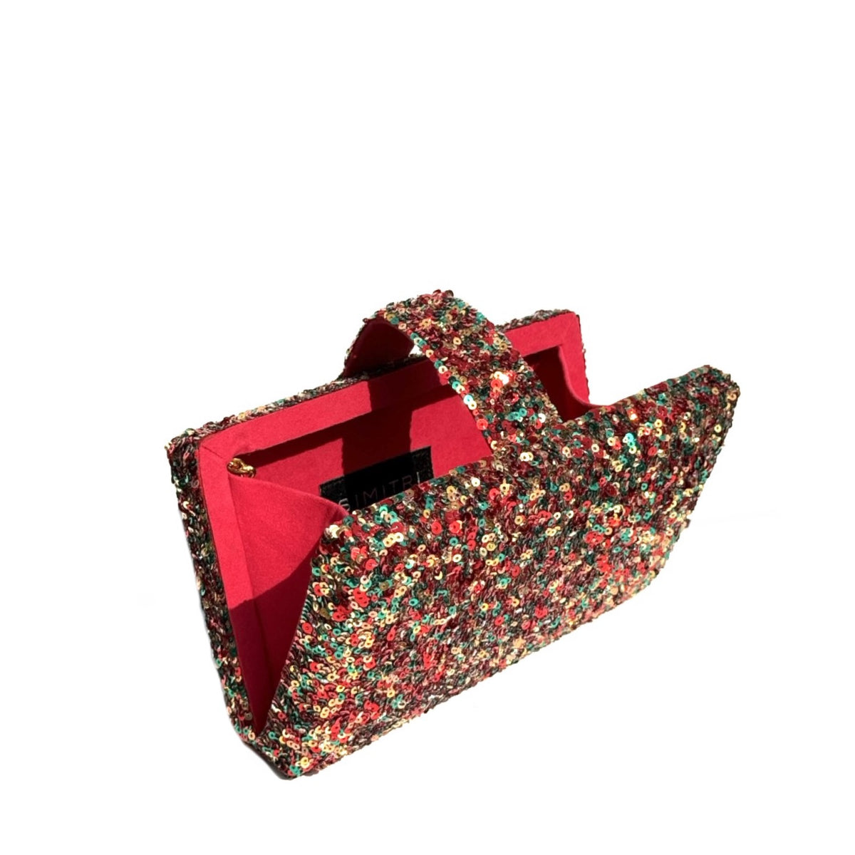 A structured evening clutch bag covered in dense red, green, and gold sequins, featuring a bright red fabric lining and a matching top handle, shown on a plain white background.