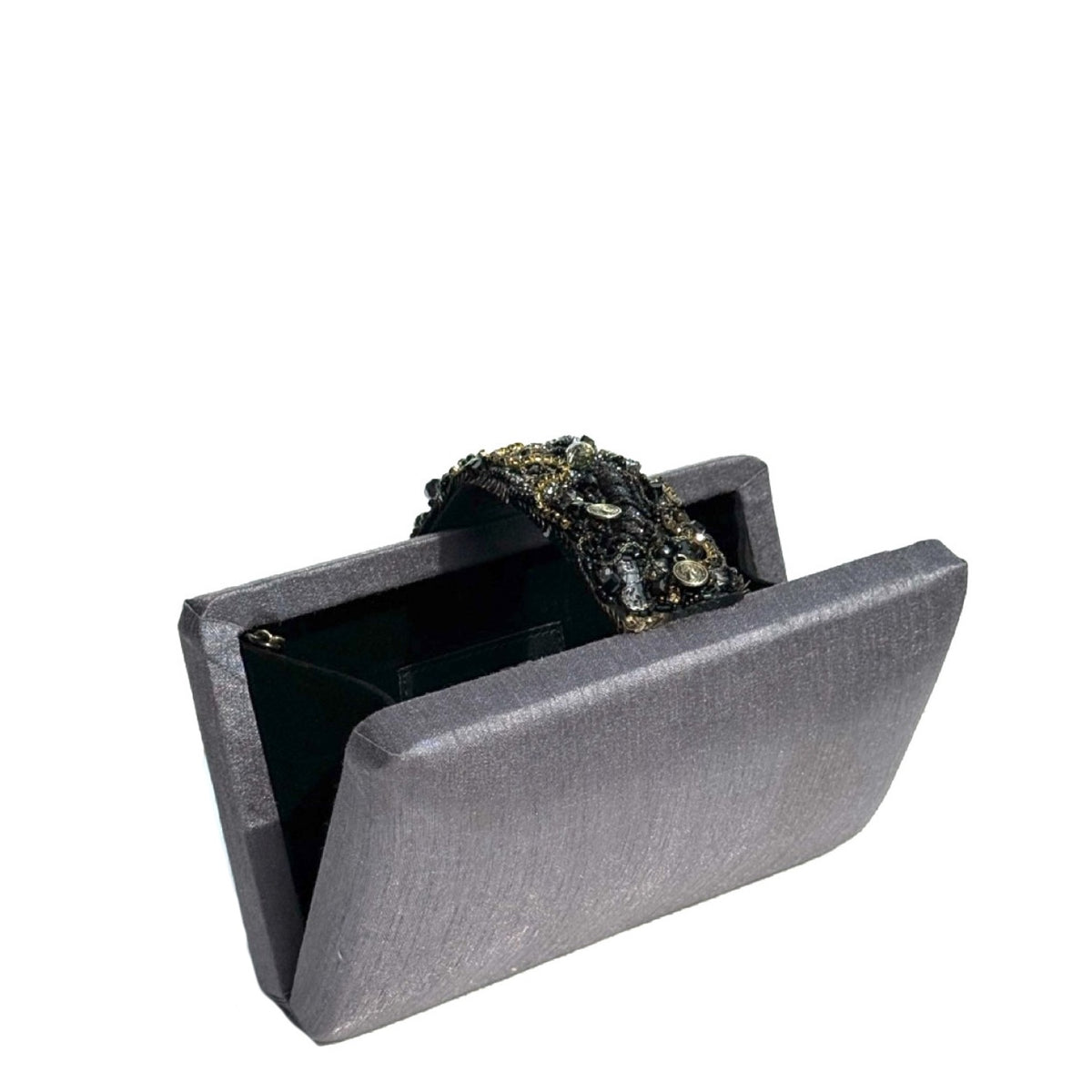 A dark gray textured clutch bag with an open flap, showcasing a black beaded wristlet strap with gold accents resting inside.